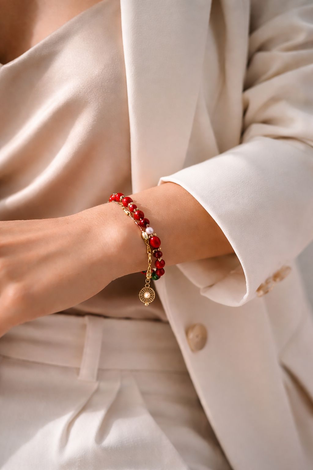 Glossy red beaded bracelet Glossy red beaded bracelet worn with an elegant neutral outfitworn with an elegant neutral outfit